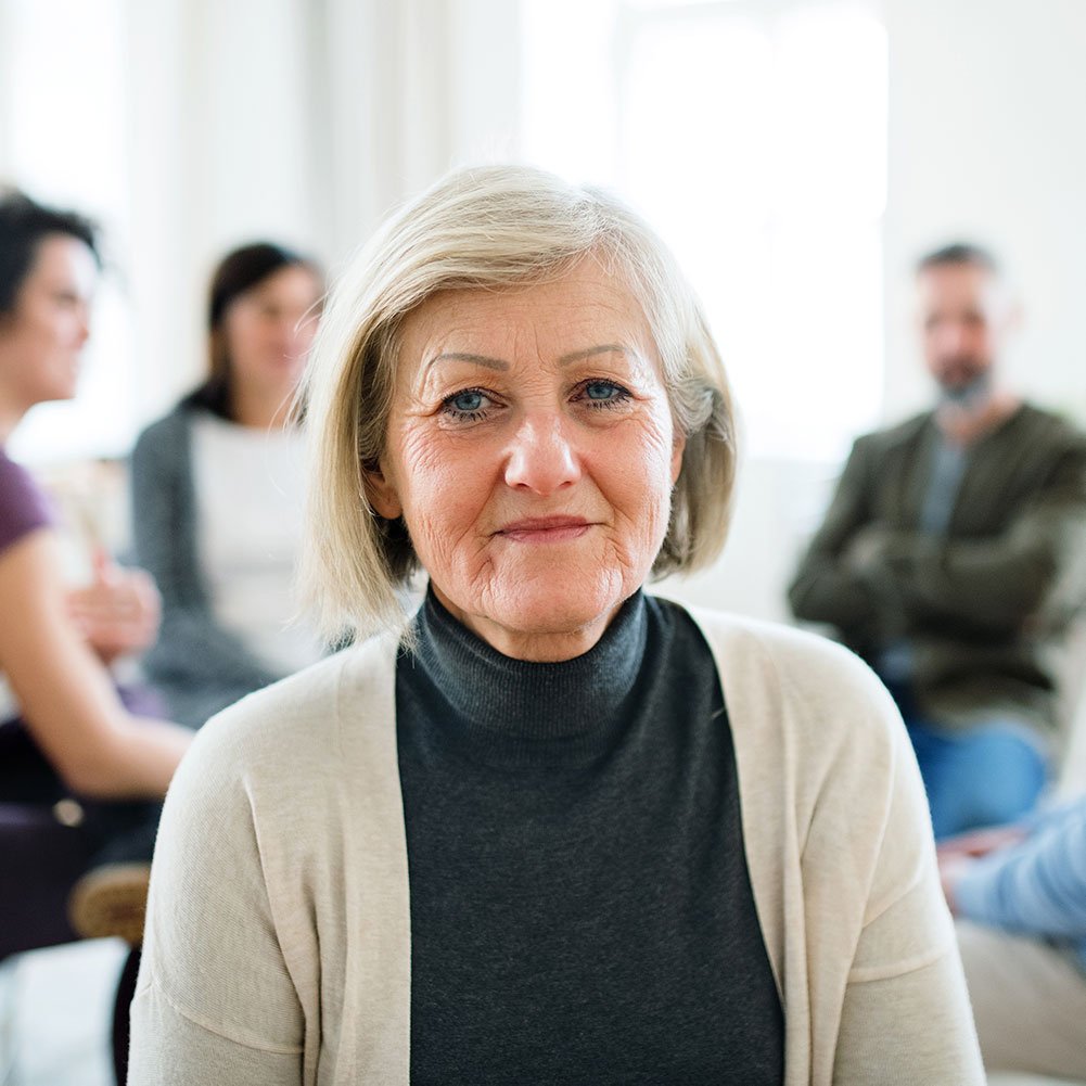 a-portrait-of-senior-depressed-woman-during-group-DZMBG7R.jpg