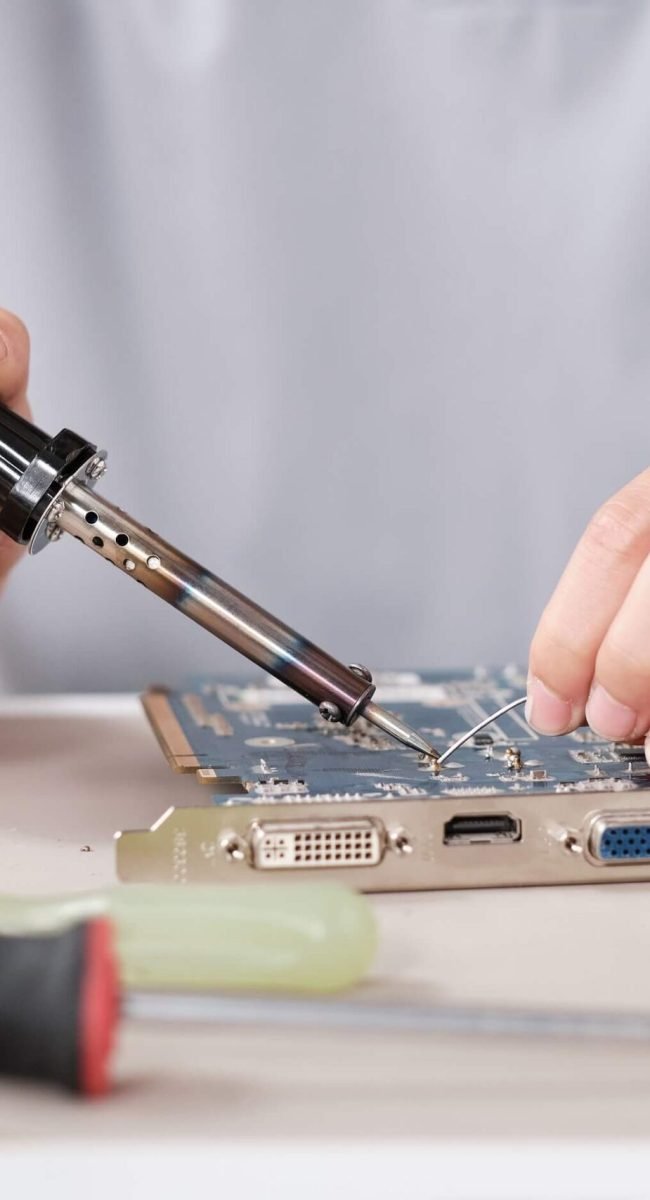 hands-of-young-contemporary-technician-with-solder-2021-12-23-00-14-30-utc.jpg