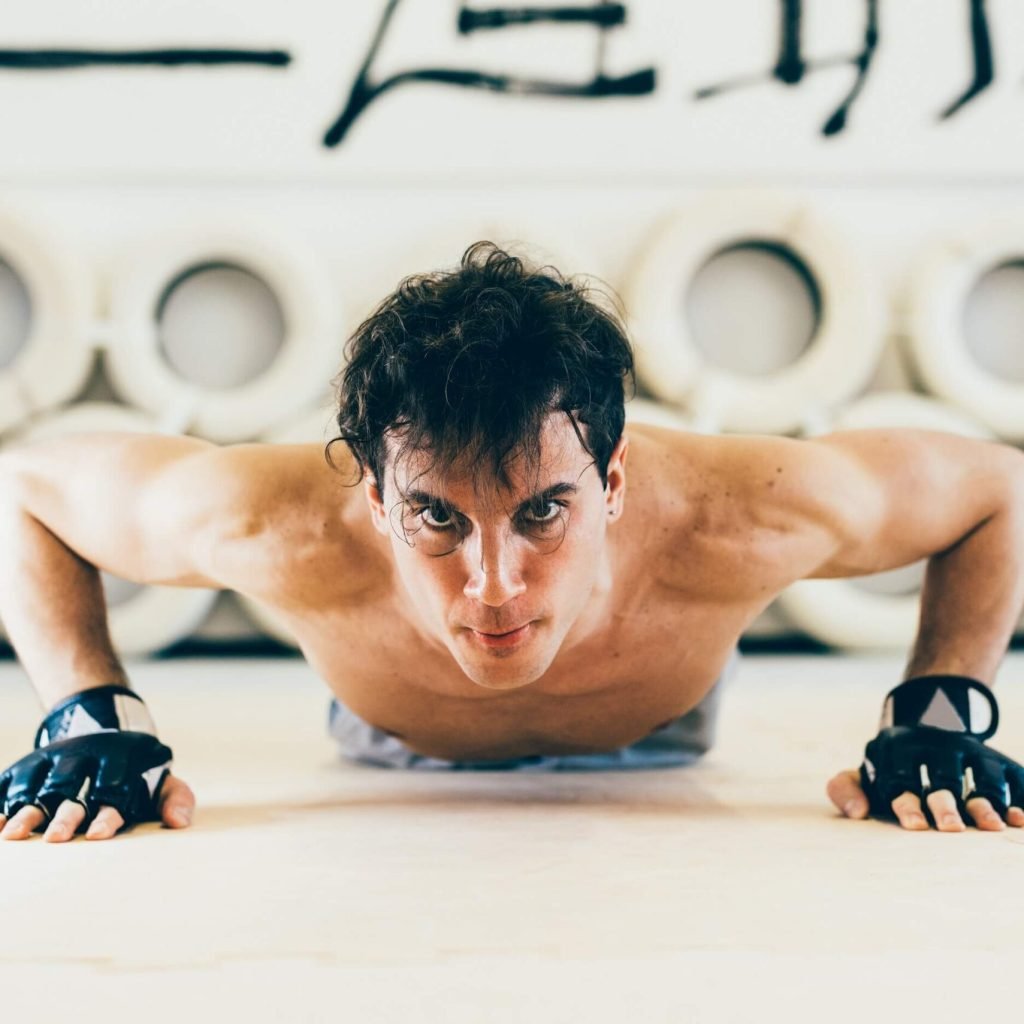 man-looking-at-camera-doing-press-ups-2022-03-04-01-53-44-utc-scaled.jpg